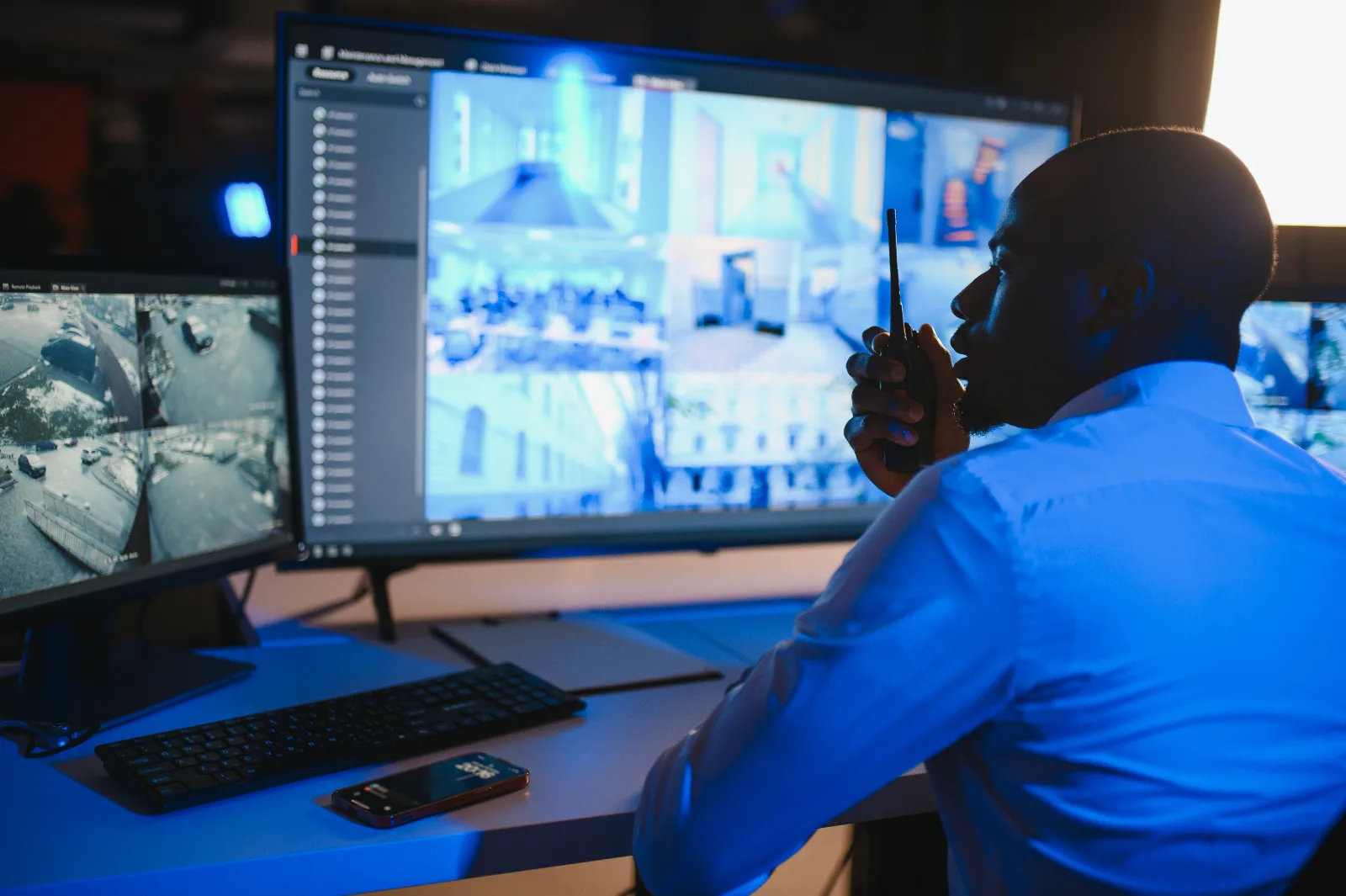 Security operator monitoring surveillance feeds